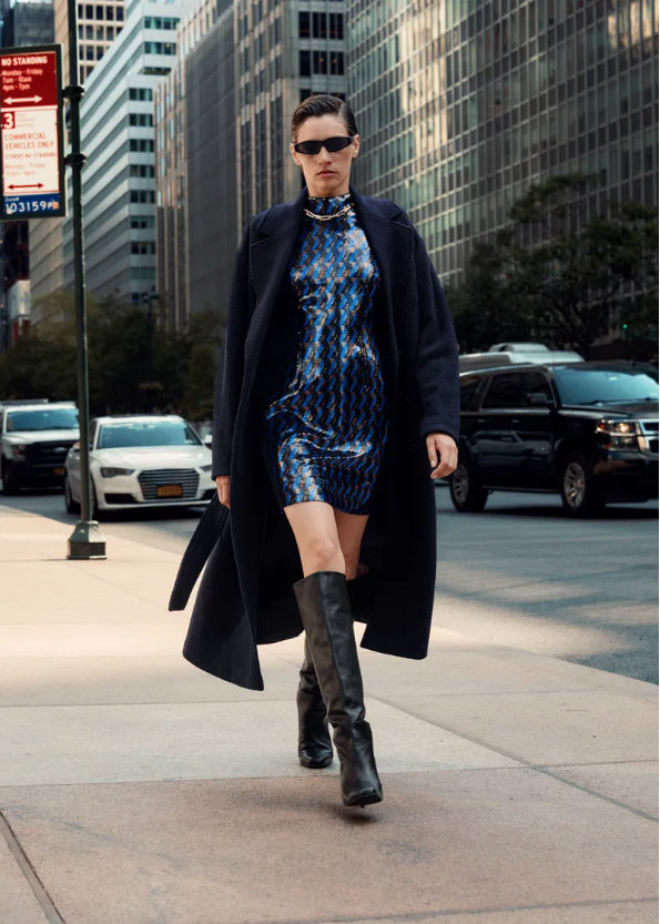 woman in fashion clothes walking on the street